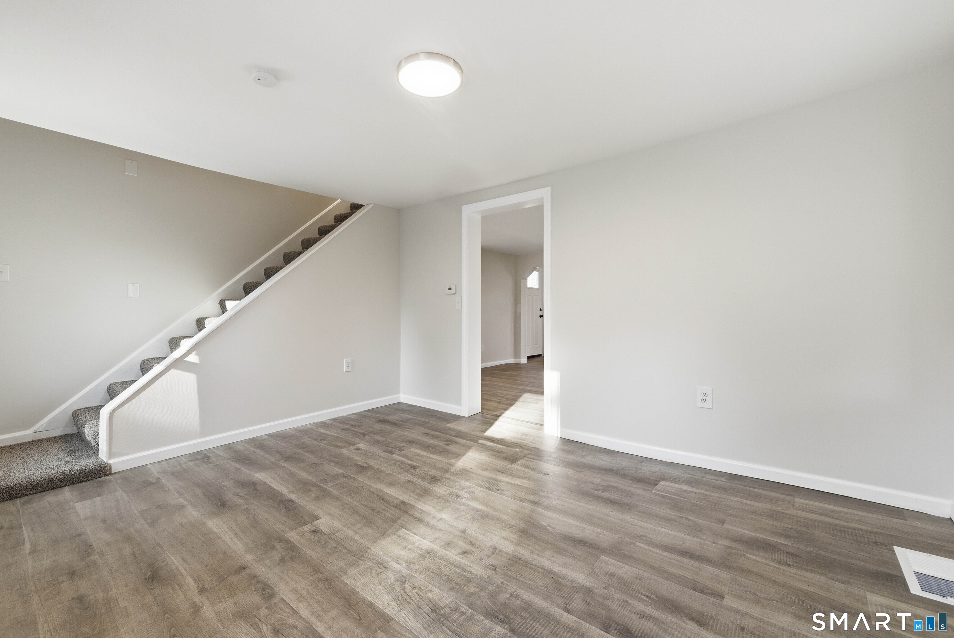 40 Tarbox Road Plainfield, CT 06374 - Photo 22 of 33 a view of an empty room with wooden floor