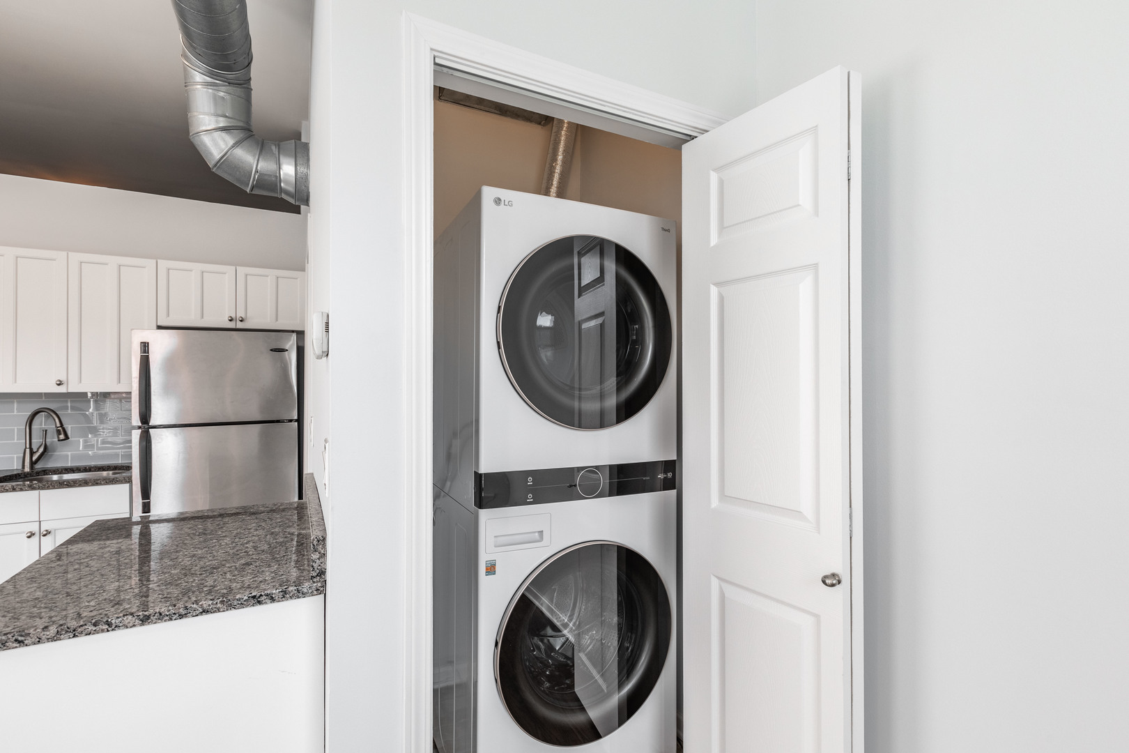 1133 West Madison Street, Unit 2R Chicago, IL 60607 - Photo 9 of 15 a utility room with dryer and washer
