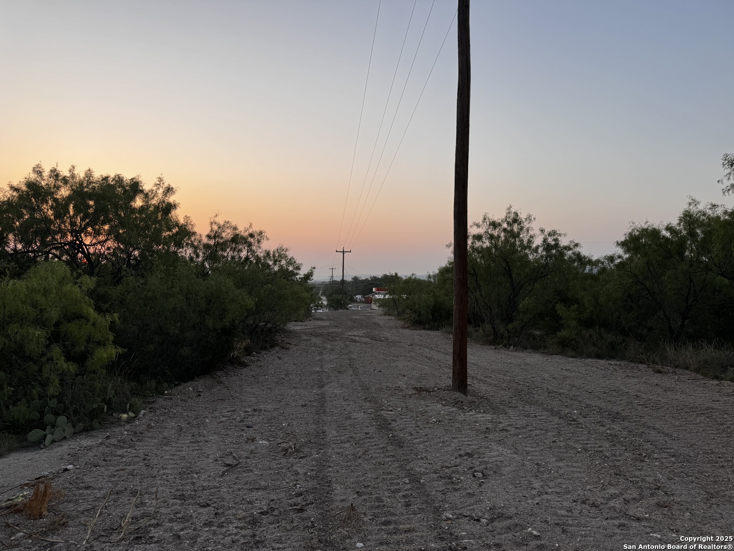 1979 Main Junction Junction, TX 76849 - Photo 3 of 10 a view of a road with a yard