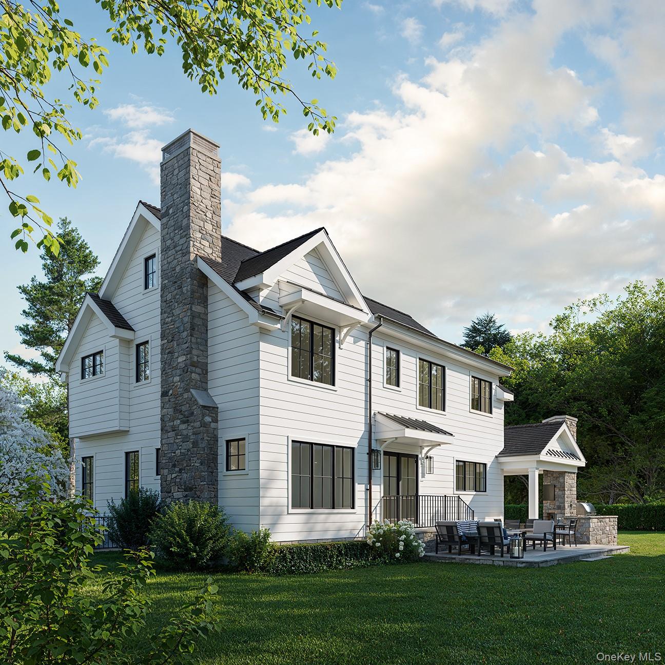 28 Everett Street Rye, NY 10580 - Photo 3 of 21 a front view of a house with a garden