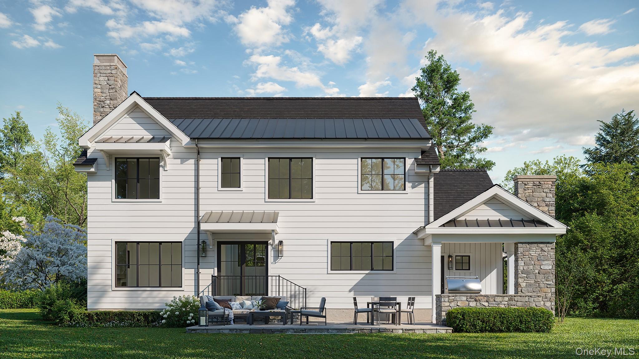 28 Everett Street Rye, NY 10580 - Photo 4 of 21 a front view of a house with a garden