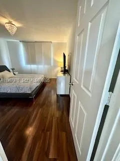 a bedroom with a bed and a rug