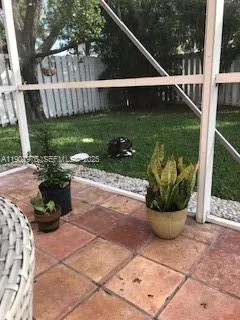 a view of a backyard with sitting area
