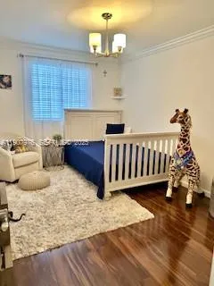 a bed room with furniture and wooden floor