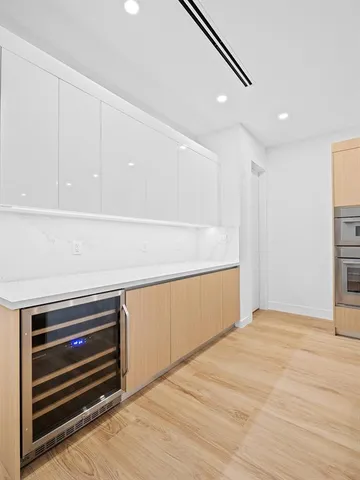 a bedroom with a bed and a mirror