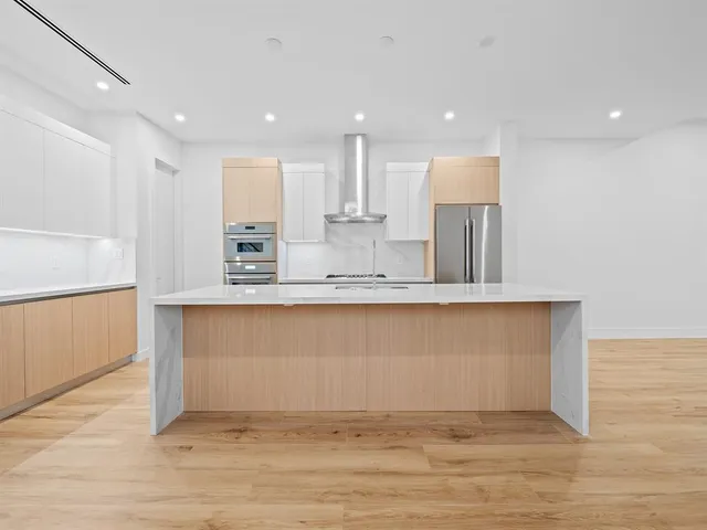 a view of an empty room and glass door