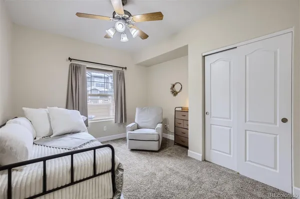 a bedroom with furniture and a window