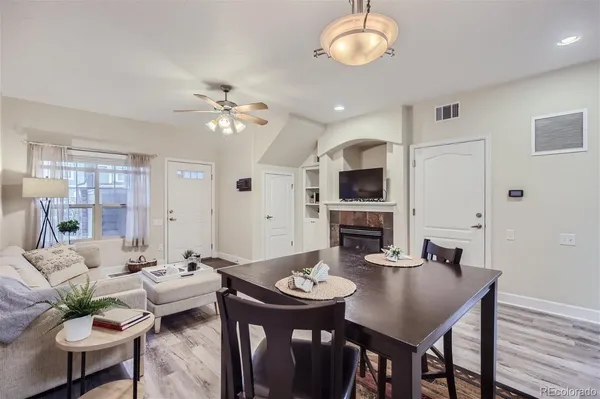 a view of a dining room with furniture and wooden floor