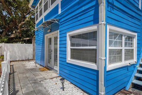 a bedroom with a bed and a chair