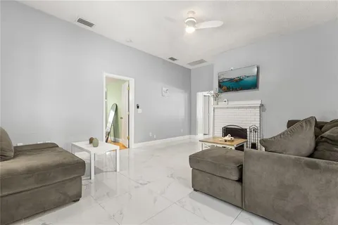 a view of a room with wooden floor and windows
