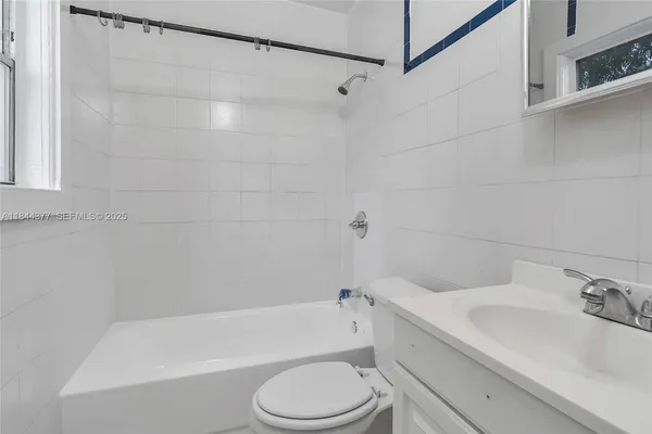 a bathroom with a sink toilet and bathtub