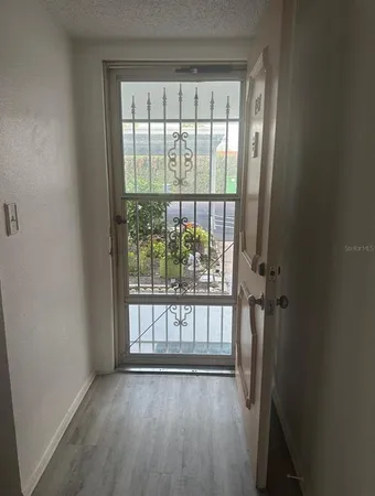 a view of entryway with wooden floor