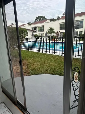 a view of swimming pool with outdoor seating