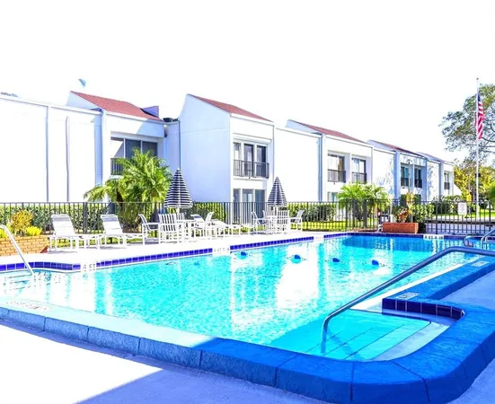 a view of swimming pool with outdoor seating