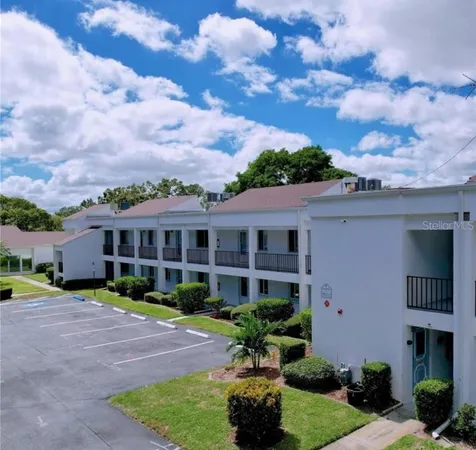 a front view of a house with garden and porch