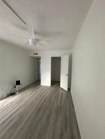 a view of a livingroom with wooden floor and closet