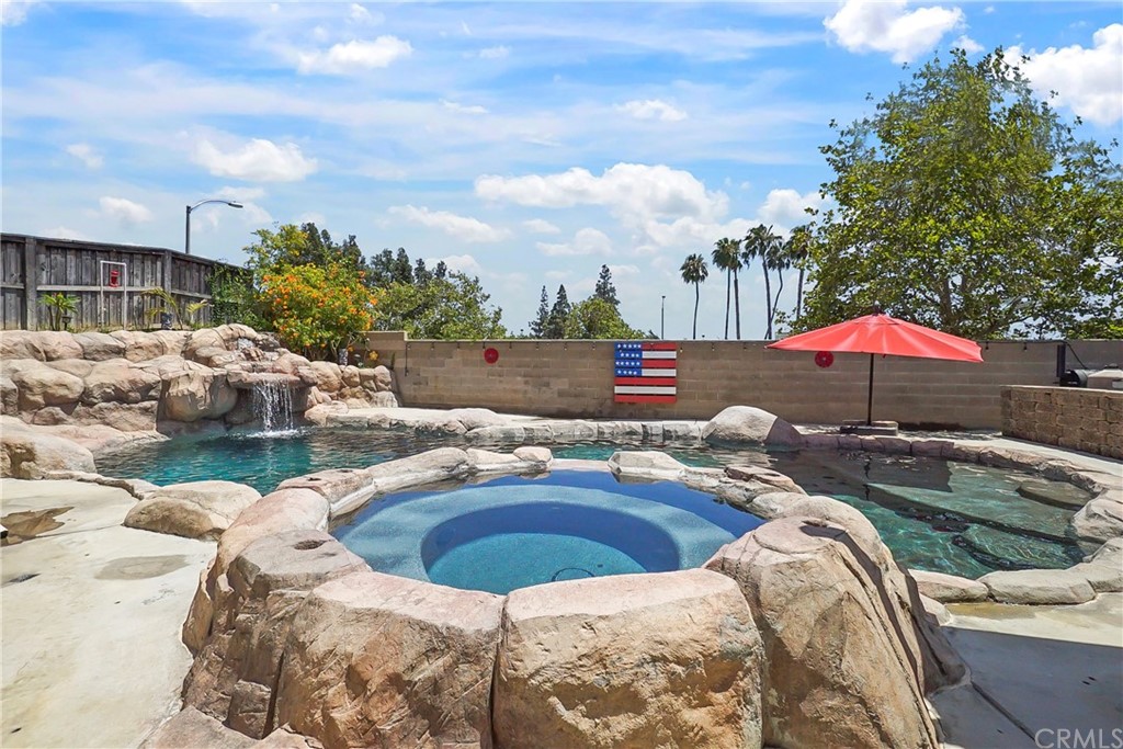 7760 Maria Drive Riverside, CA 92509 - Photo 1 of 1 a view of swimming pool with outdoor seating