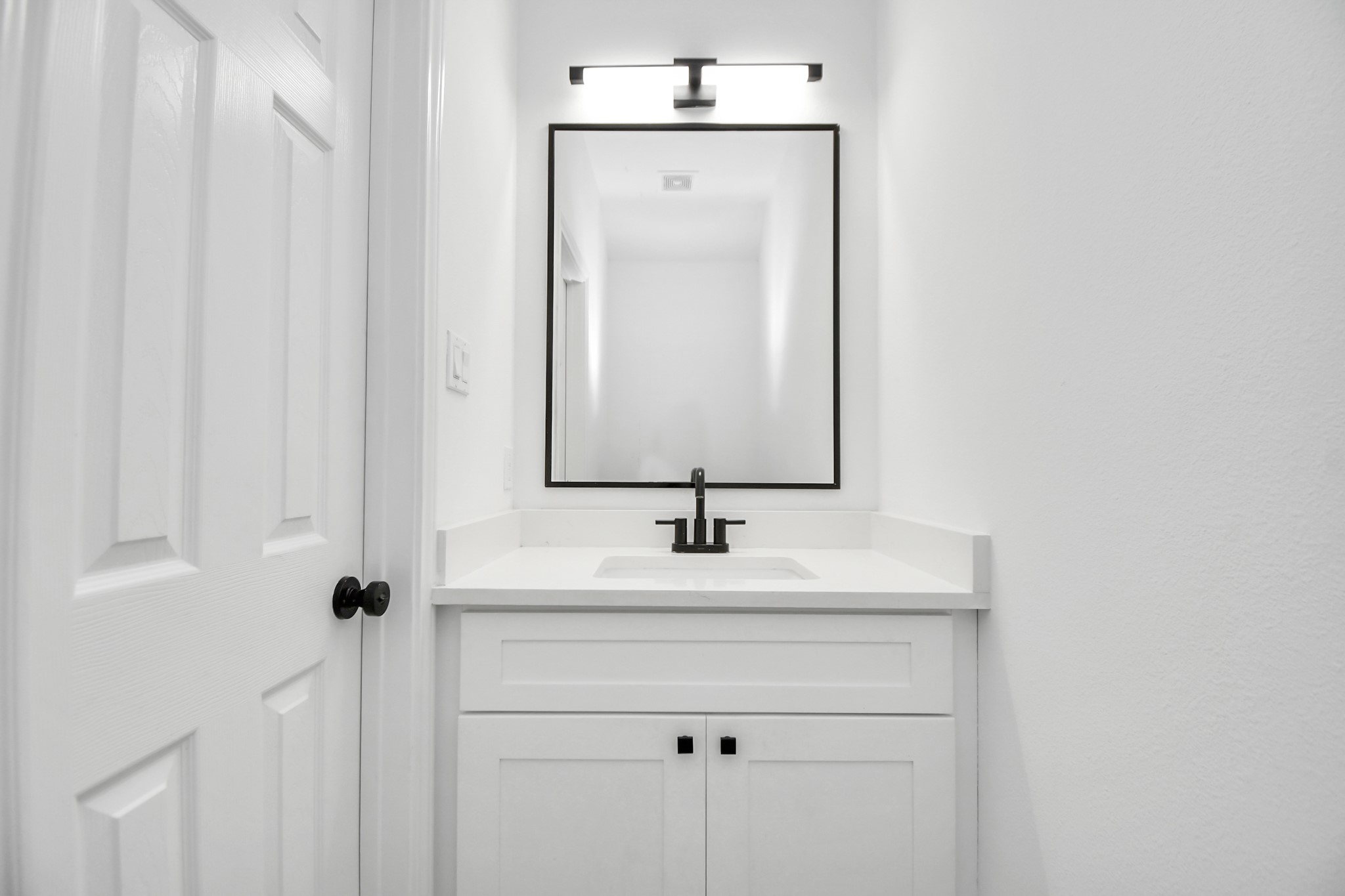 9003 Prairie View Drive, Unit B Houston, TX 77088 - Photo 6 of 20 a bathroom with a sink and a mirror