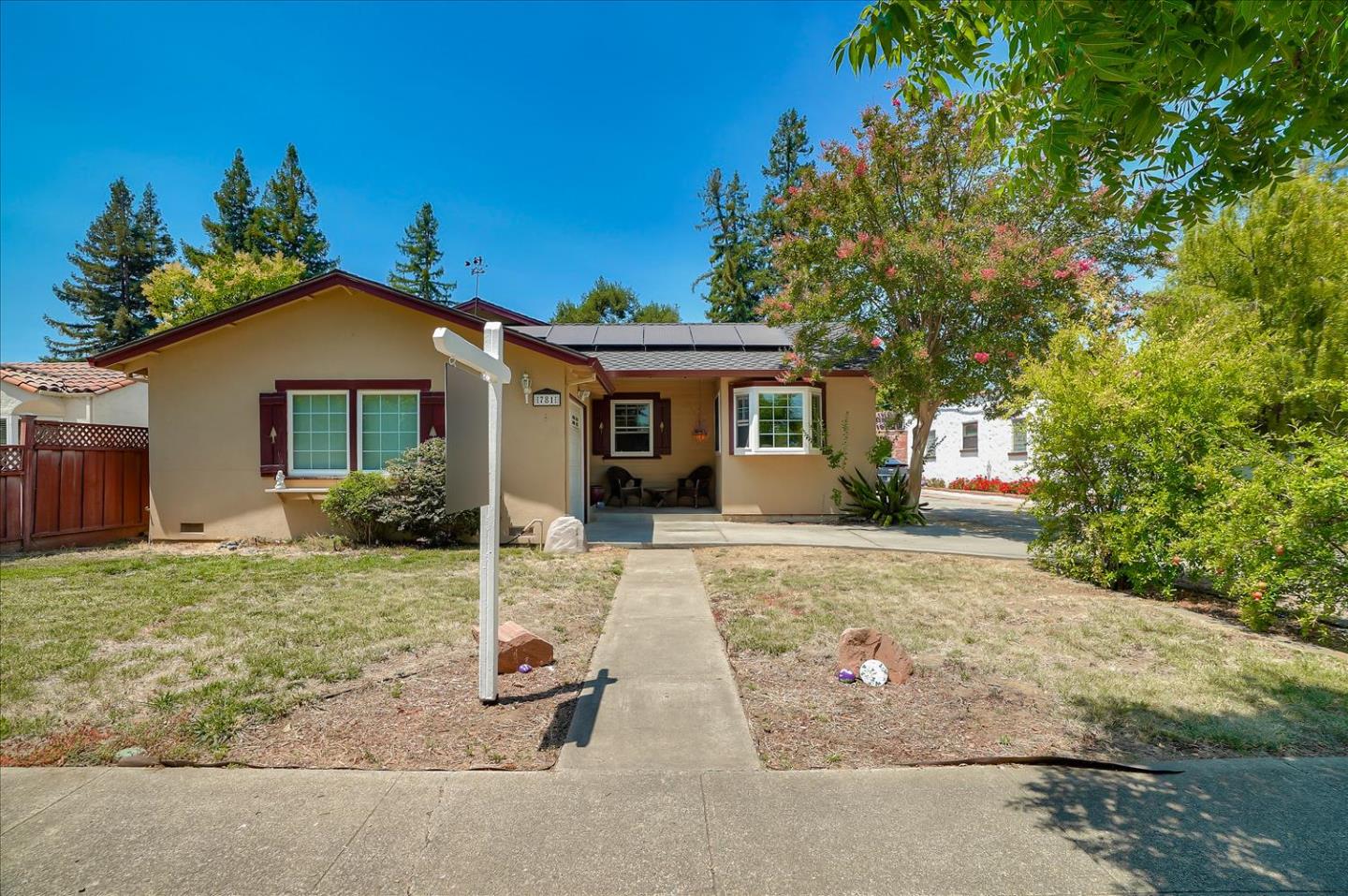 a front view of a house with garden