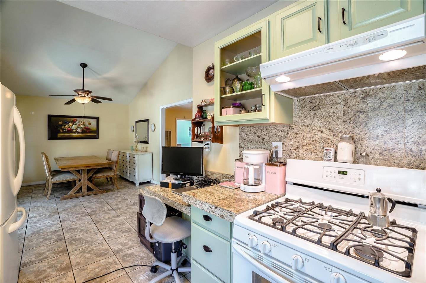 781 5th Street Gilroy, CA 95020 - Photo 11 of 33 a kitchen with a stove a sink and a microwave