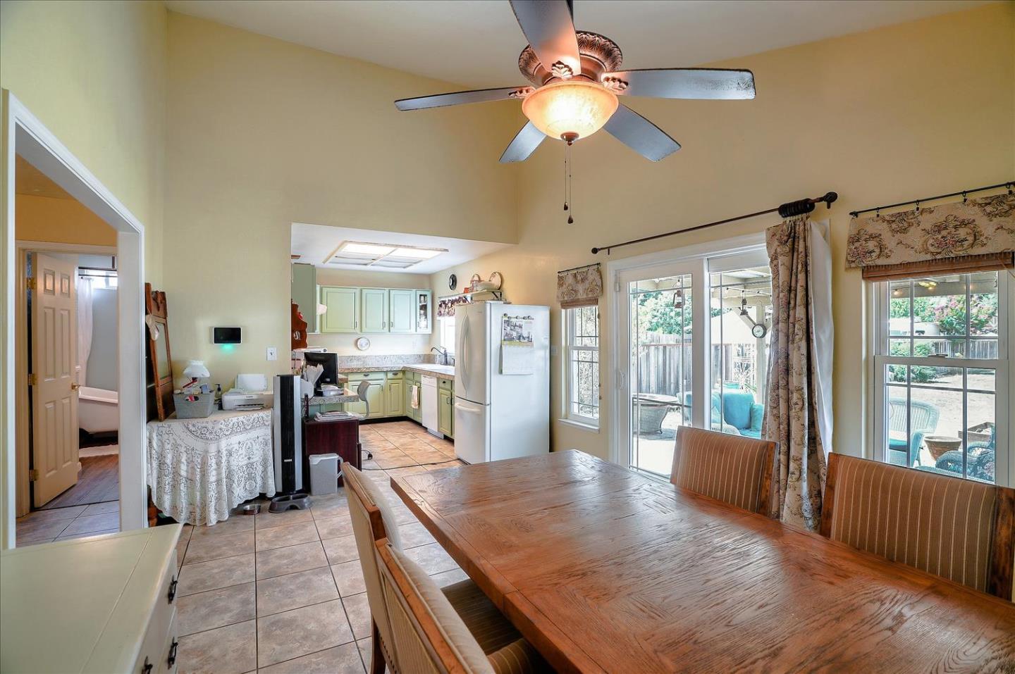 781 5th Street Gilroy, CA 95020 - Photo 13 of 33 a living room with furniture a flat screen tv and a large window