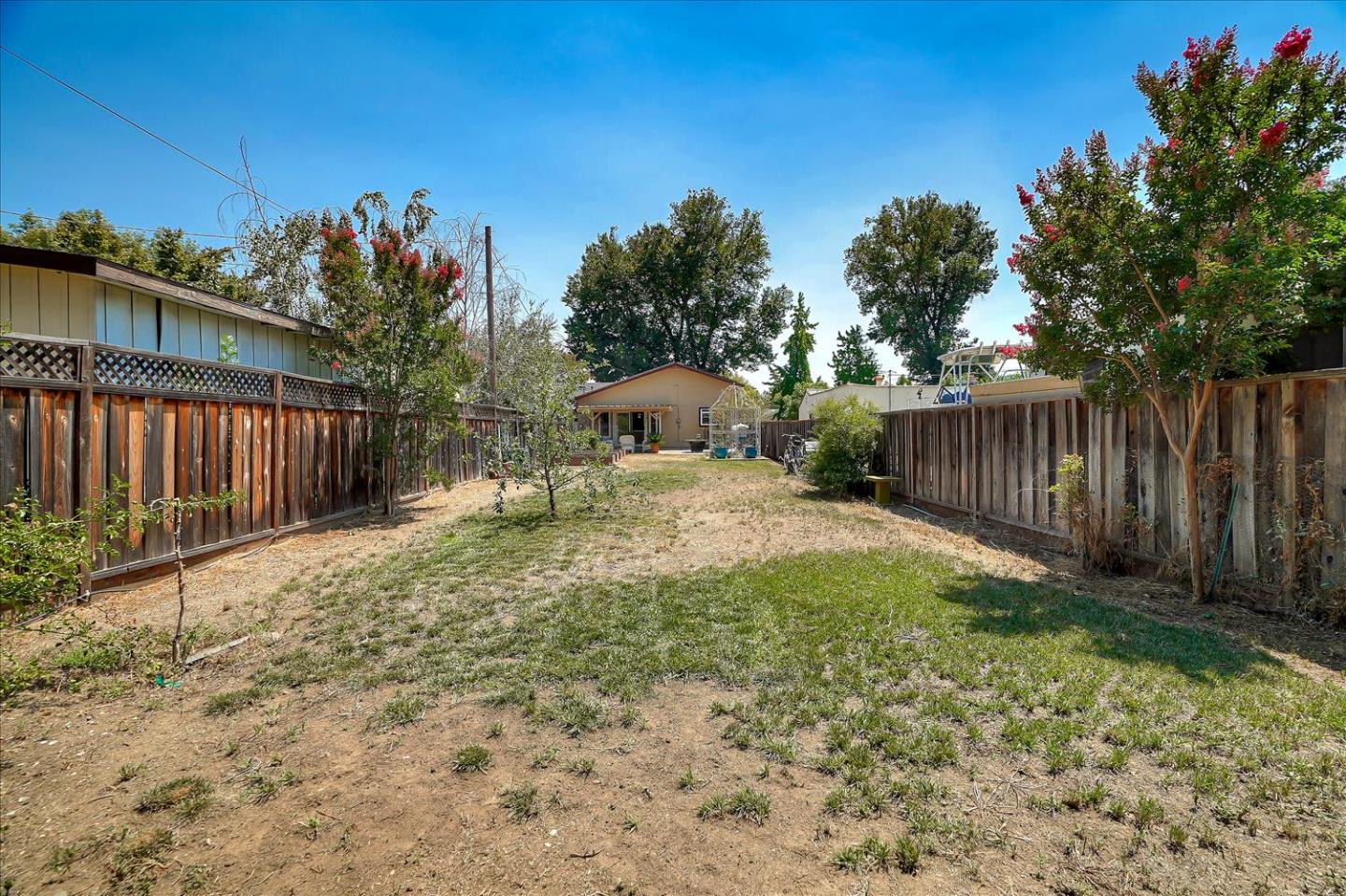 781 5th Street Gilroy, CA 95020 - Photo 23 of 33 a backyard of a house with wooden fence