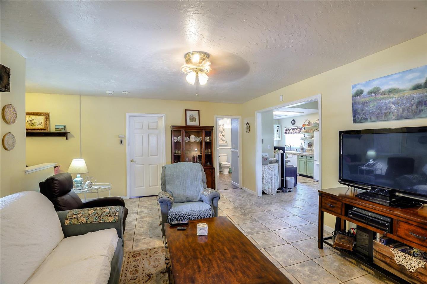 781 5th Street Gilroy, CA 95020 - Photo 6 of 33 a living room with furniture and a flat screen tv
