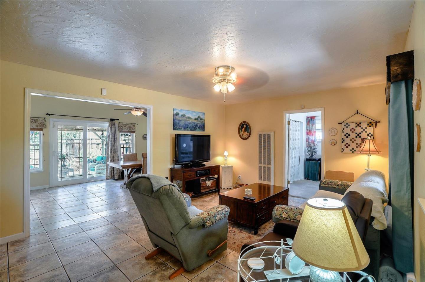 781 5th Street Gilroy, CA 95020 - Photo 7 of 33 a living room with furniture a couch and a chandelier
