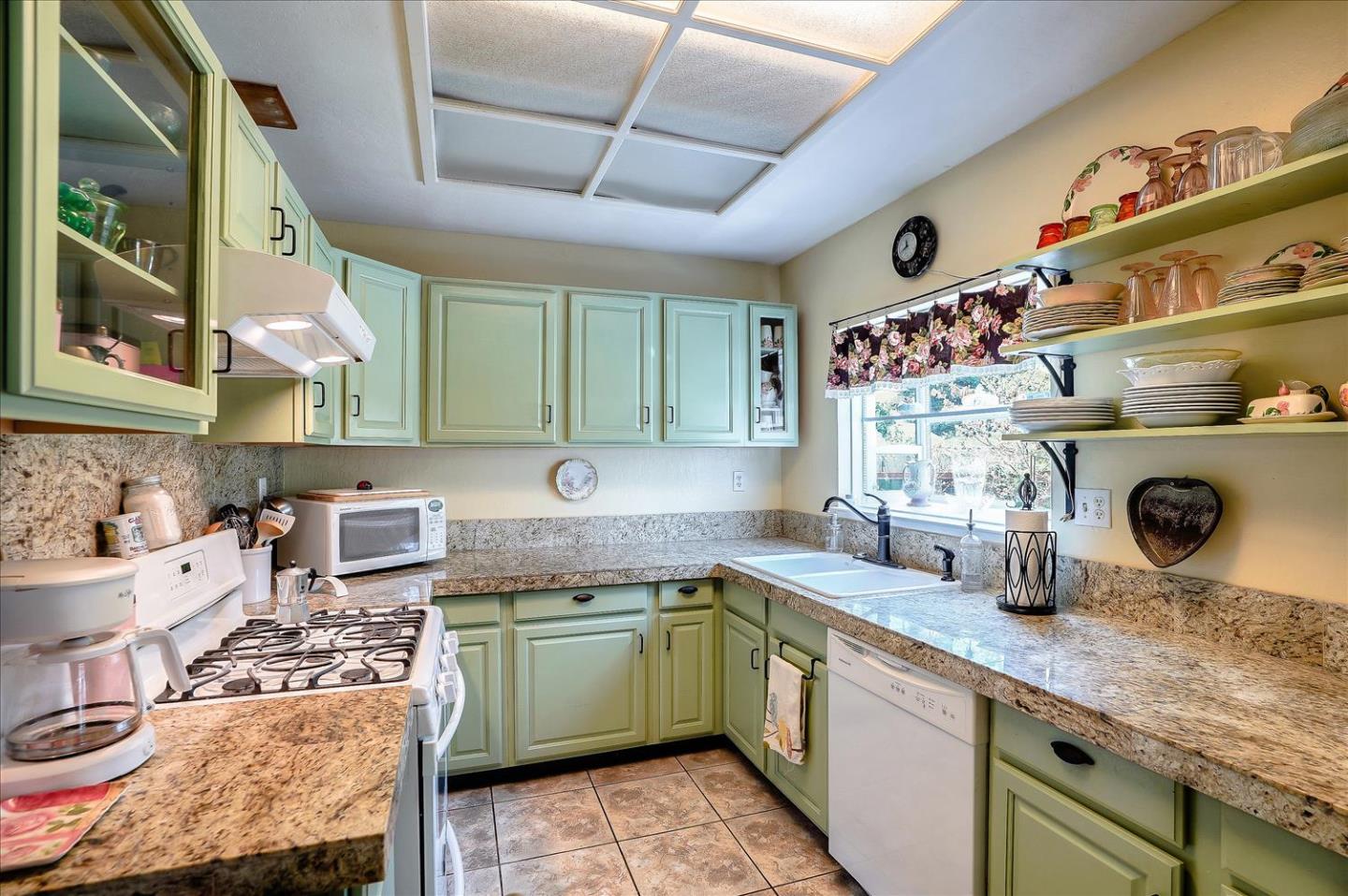 781 5th Street Gilroy, CA 95020 - Photo 8 of 33 a kitchen with a sink a stove and cabinets