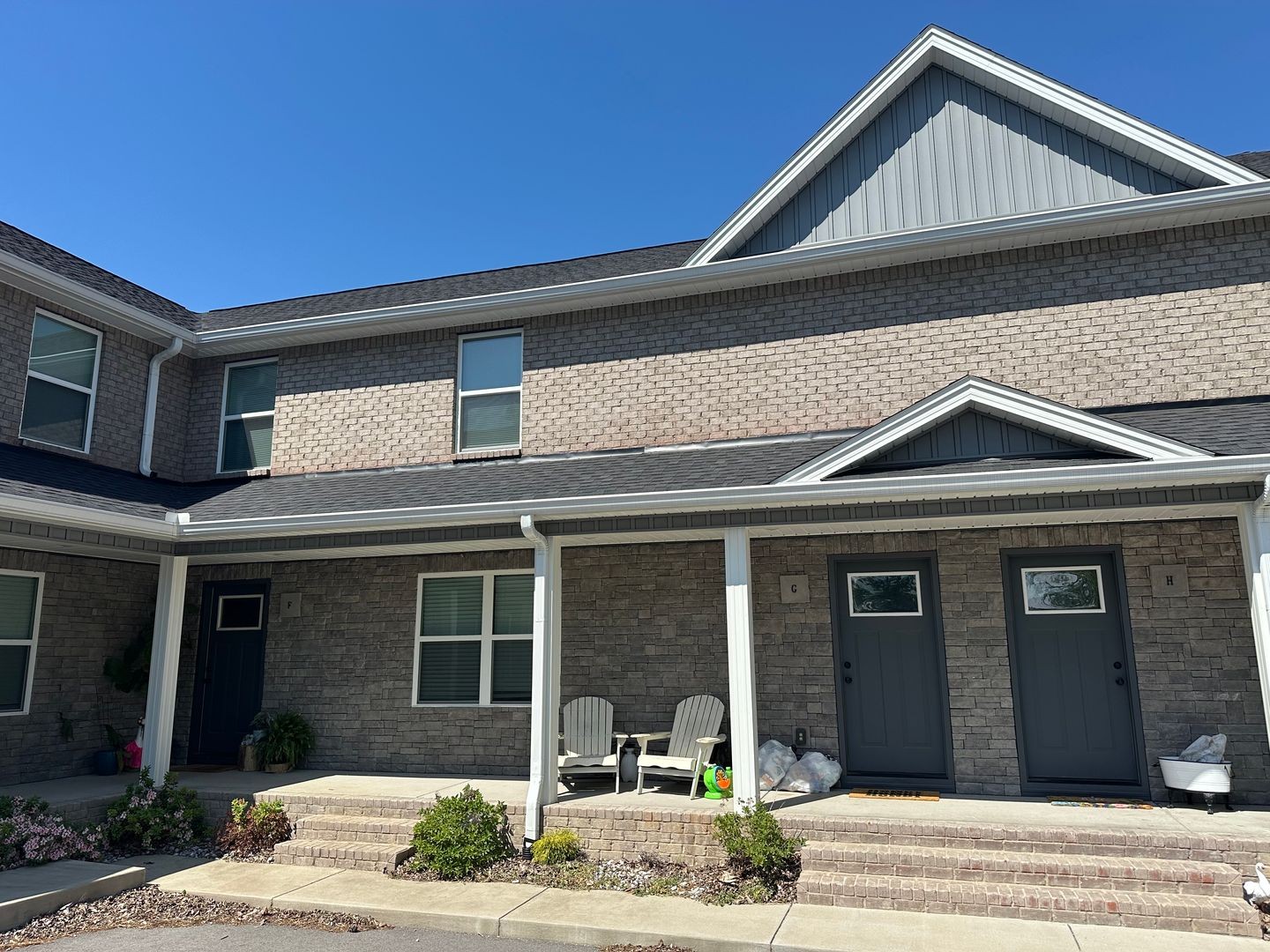 705 Haley Street, Unit G Lafayette, TN 37083 - Photo 1 of 3 a front view of a house with garden