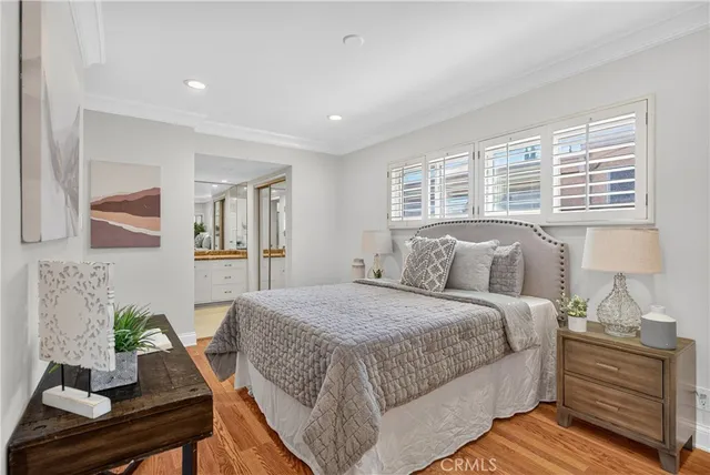 a bedroom with a bed and a table