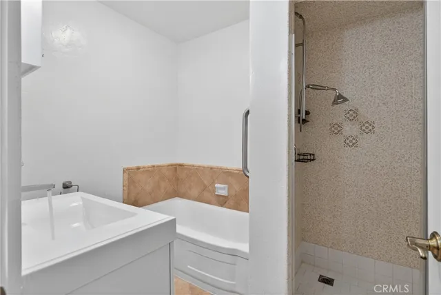 a bathroom with a sink and a shower