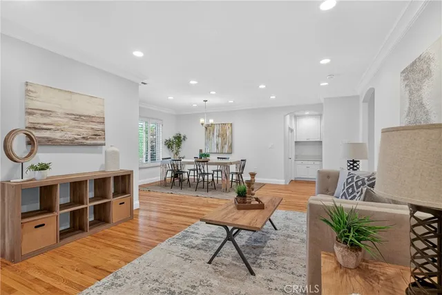 a living room with furniture a rug and white walls