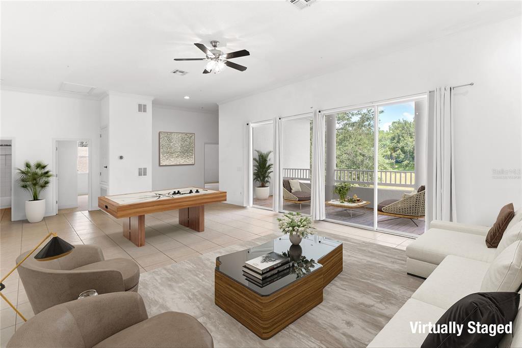 2718 Knightsbridge Road Clermont, FL 34711 - Photo 11 of 32 a living room with furniture and a large window