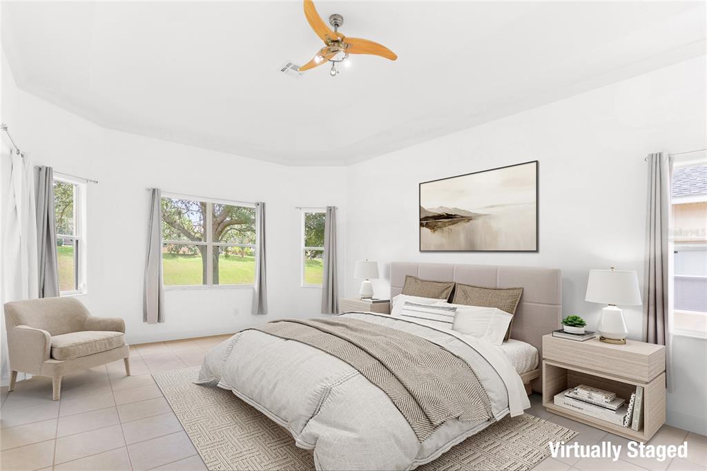 2718 Knightsbridge Road Clermont, FL 34711 - Photo 15 of 32 a bedroom with a bed and a couch