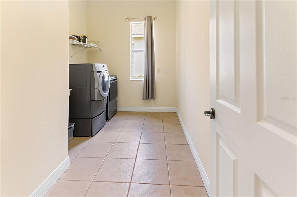2718 Knightsbridge Road Clermont, FL 34711 - Photo 24 of 32 a view of a storage & utility room with a washer dryer