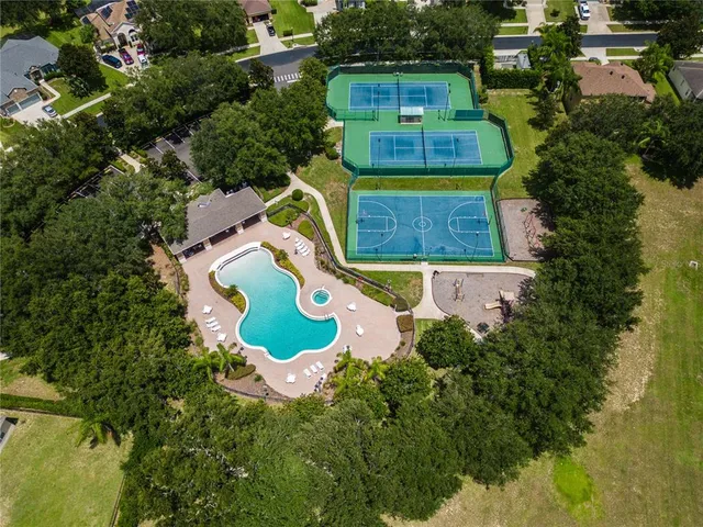 an aerial view of a house with a swimming pool