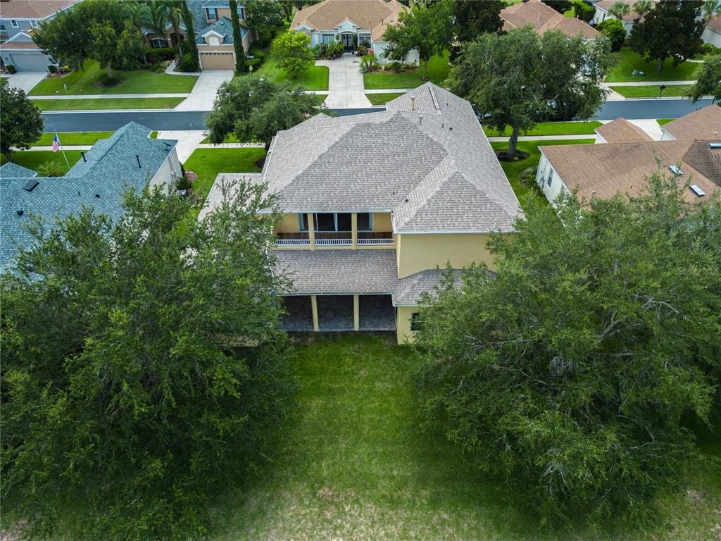 2718 Knightsbridge Road Clermont, FL 34711 - Photo 27 of 28 a aerial view of a house with a yard table and chairs