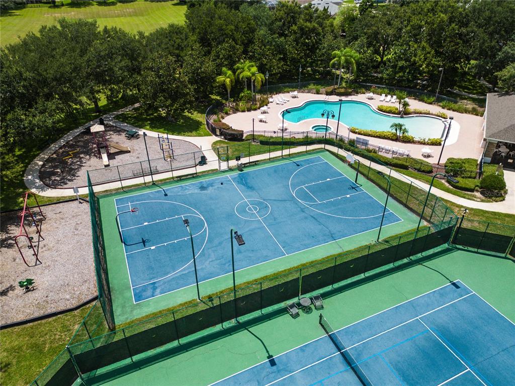 2718 Knightsbridge Road Clermont, FL 34711 - Photo 32 of 32 an aerial view of a house with a swimming pool