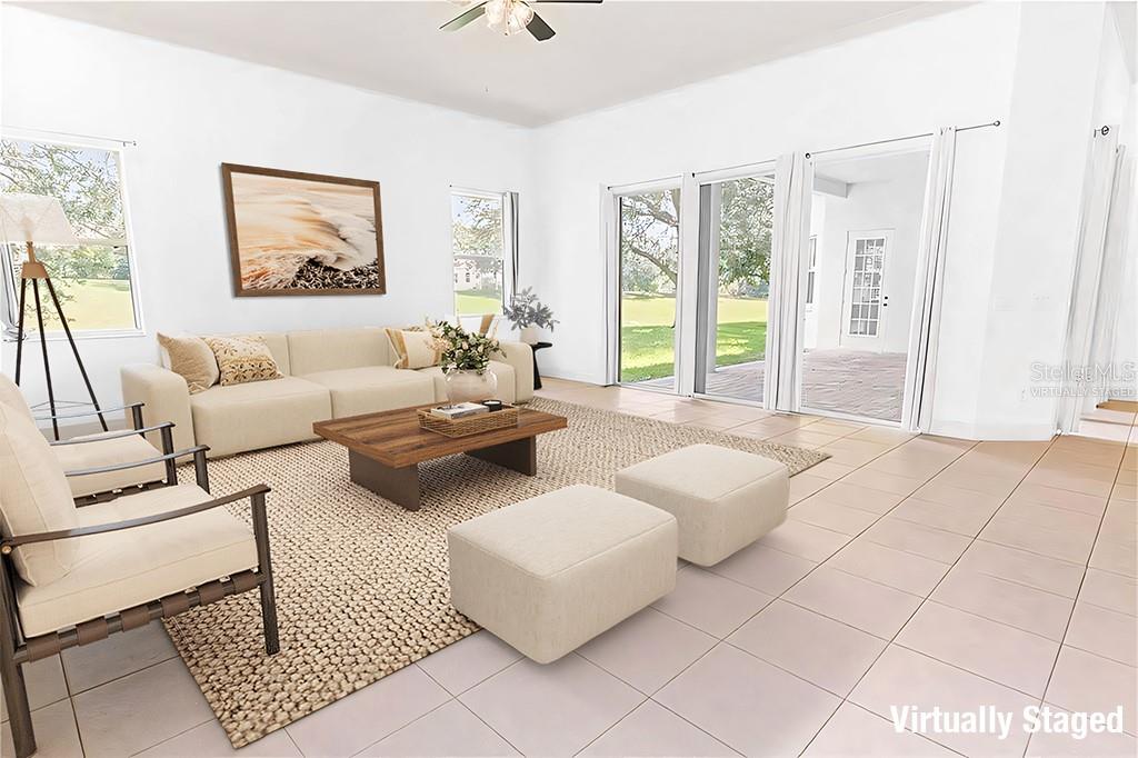 2718 Knightsbridge Road Clermont, FL 34711 - Photo 8 of 32 a bedroom with furniture and large windows