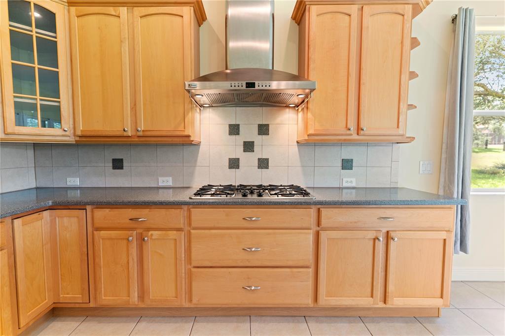 2718 Knightsbridge Road Clermont, FL 34711 - Photo 8 of 28 a kitchen with granite countertop a sink and cabinets