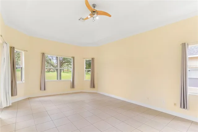 a spacious bathroom with a tub sink and mirror