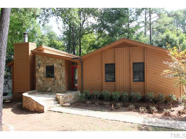 6248 Rushingbrook Drive Raleigh, NC 27612 - Photo 1 of 25 a front view of a house with a yard