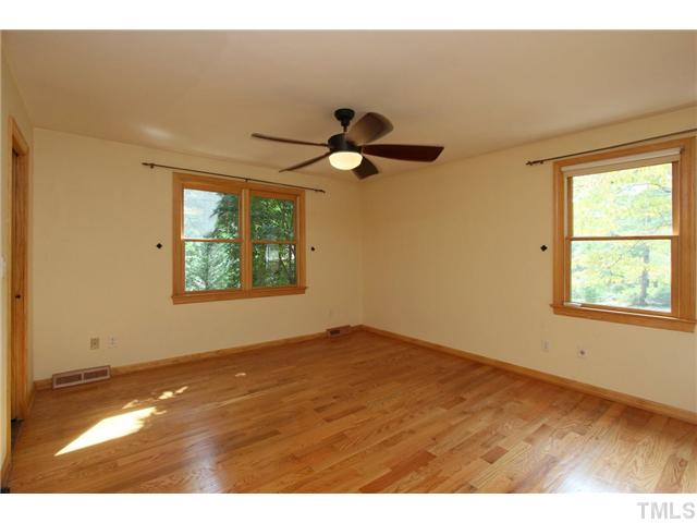 6248 Rushingbrook Drive Raleigh, NC 27612 - Photo 17 of 25 a view of an empty room and window