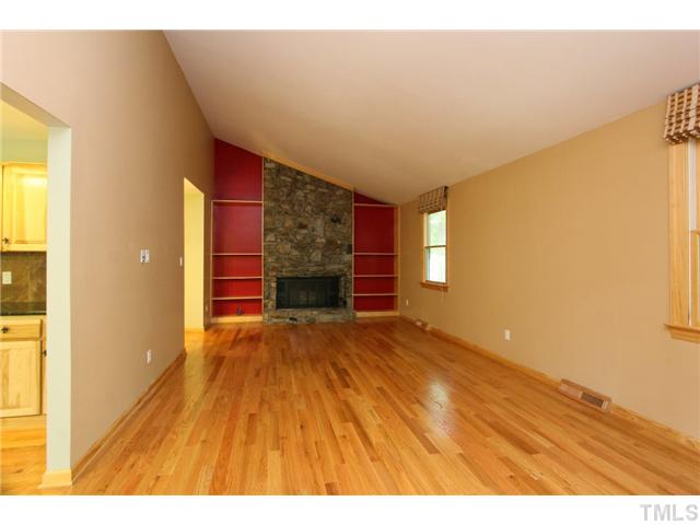 6248 Rushingbrook Drive Raleigh, NC 27612 - Photo 6 of 25 a view of empty room with wooden floor and fan