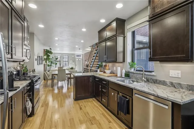 a kitchen with lots of counter top space and stainless steel appliances