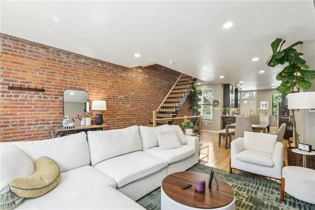 a living room with furniture and a lamp