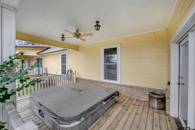 a roof deck with table and chairs