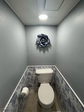 a bathroom with a toilet and a sink