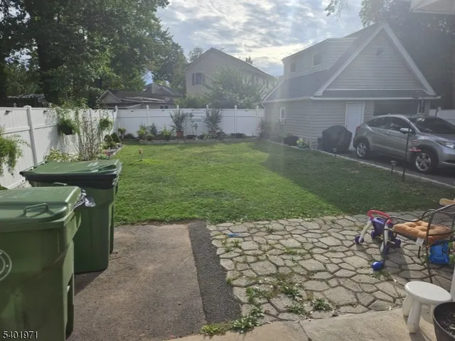 a view of a backyard with sitting area